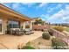 Relaxing patio space with comfortable seating and a charming water feature at 2062 Dipinto Ave, Henderson, NV 89052