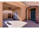 Covered front entrance with brick accents, leading to a charming doorway at 2219 Sawtooth Mountain Dr, Henderson, NV 89044