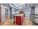 Kitchen with a large red island, granite countertops, and a tray ceiling at 2508 Rancho Bel Air Dr, Las Vegas, NV 89107