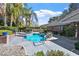 Backyard pool with mature landscaping and a brick-trimmed patio and concrete decking at 2508 Rancho Bel Air Dr, Las Vegas, NV 89107