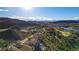 Breathtaking aerial view of a luxury community nestled in the mountains, with lush greenery and stunning mountain views at 30 Via Tiberius Way, Henderson, NV 89011