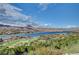 Magnificent aerial view of a serene lake community with golf course and picturesque mountain views at 30 Via Tiberius Way, Henderson, NV 89011
