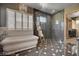 Luxurious bathroom with a standalone tub, marble shower, and plantation shutters at 30 Via Tiberius Way, Henderson, NV 89011