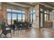 Dining room with stone walls, wood beam ceilings, and large windows offering views at 30 Via Tiberius Way, Henderson, NV 89011