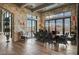 Dining room with stone walls, wood ceilings, and french doors at 30 Via Tiberius Way, Henderson, NV 89011