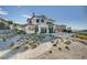 Stunning luxury home with beautiful stone facade, manicured landscaping, and a grand entrance at 30 Via Tiberius Way, Henderson, NV 89011