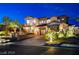 Stunning stone accented home, featuring a curved staircase leading to the entrance, and a driveway paved with cobblestones at 30 Via Tiberius Way, Henderson, NV 89011