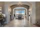 Grand foyer with arched entryways and views of the lake at 30 Via Tiberius Way, Henderson, NV 89011