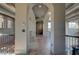 Hallway with arched doorways, wood beams, and wood flooring at 30 Via Tiberius Way, Henderson, NV 89011