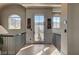 Hallway leading to an outdoor balcony featuring mountain views, wood floors, and stylish light fixtures at 30 Via Tiberius Way, Henderson, NV 89011