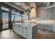 Spacious kitchen with marble countertops, a center island, and stainless steel appliances at 30 Via Tiberius Way, Henderson, NV 89011