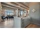 Kitchen with gray cabinets and stone walls with dining room view at 30 Via Tiberius Way, Henderson, NV 89011