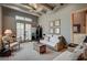 Bright living room with high ceilings, exposed wood beams, and comfortable seating at 30 Via Tiberius Way, Henderson, NV 89011