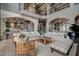 Open living room with high ceilings, comfortable seating, and lake views at 30 Via Tiberius Way, Henderson, NV 89011