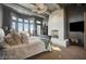 Spacious main bedroom features large windows, fireplace, ceiling fan, and gorgeous view at 30 Via Tiberius Way, Henderson, NV 89011