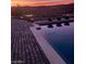 Stunning infinity pool with desert sunset background at 30 Via Tiberius Way, Henderson, NV 89011