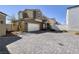 Two-story home featuring a wide driveway and a two-car garage at 357 Stone Fly Rd, North Las Vegas, NV 89032
