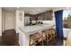 Modern kitchen featuring granite countertops and dark wood flooring at 357 Stone Fly Rd, North Las Vegas, NV 89032