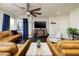 Cozy living room featuring a ceiling fan, dark wood floors, and comfortable seating at 357 Stone Fly Rd, North Las Vegas, NV 89032