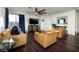 Comfortable living room featuring a flat-screen TV, hardwood floors, and stylish decor at 357 Stone Fly Rd, North Las Vegas, NV 89032
