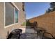 Private patio features lounge seating, artificial grass, and privacy fencing at 357 Stone Fly Rd, North Las Vegas, NV 89032