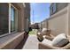Private patio features lounge seating, artificial grass, and privacy fencing at 357 Stone Fly Rd, North Las Vegas, NV 89032