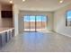 Bright living room with hardwood floors, recessed lighting, and sliding glass doors leading to the backyard at 370 Haddocks Hall Pl, Henderson, NV 89011