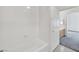 Bright bathroom featuring tub, tile surround, and linen closet at 3933 Lazy Pine St # 204, Las Vegas, NV 89108