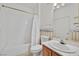Cozy bathroom with matching white sink and toilet along with a full size tub and shower at 3933 Lazy Pine St # 204, Las Vegas, NV 89108