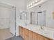 Bathroom with double sinks and large mirror with separate vanity area at 3933 Lazy Pine St # 204, Las Vegas, NV 89108