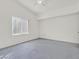 Primary bedroom with large window, neutral carpet and light walls at 3933 Lazy Pine St # 204, Las Vegas, NV 89108