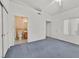 Bedroom with neutral walls, closet and bathroom with a door leading to another room at 3933 Lazy Pine St # 204, Las Vegas, NV 89108