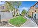 Exterior image of the property with a grassy area between apartment buildings at 3933 Lazy Pine St # 204, Las Vegas, NV 89108