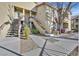 A view of the exterior of the apartment building with several staircases and walkways at 3933 Lazy Pine St # 204, Las Vegas, NV 89108