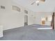 Spacious living room with high ceilings and an arched entry to the kitchen at 3933 Lazy Pine St # 204, Las Vegas, NV 89108