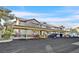 Parking area with covered parking spaces and several parked vehicles at 3933 Lazy Pine St # 204, Las Vegas, NV 89108