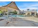 Beautiful community pool with a covered lounge area and plenty of seating at 3933 Lazy Pine St # 204, Las Vegas, NV 89108