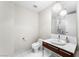 Bathroom featuring a modern vanity with marble countertop and decorative mirror and lighting at 4471 Dean Martin Dr # 2705, Las Vegas, NV 89103