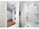 Bathroom featuring a modern stand-up shower, laundry, and marbled tile at 4471 Dean Martin Dr # 2705, Las Vegas, NV 89103