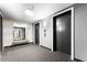 Hallway featuring elevator access, patterned carpet, and a decorative mirror with bench at 4471 Dean Martin Dr # 2705, Las Vegas, NV 89103