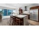 Open-concept kitchen featuring an island with seating, stainless steel appliances, and seamless access to living area at 4471 Dean Martin Dr # 2705, Las Vegas, NV 89103