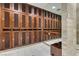 Well-appointed locker room featuring wood lockers, mirror accents, and tile flooring at 4471 Dean Martin Dr # 2705, Las Vegas, NV 89103