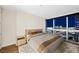 Relaxing bedroom featuring a comfortable bed, stylish bedside table, and a large window with city views at 4471 Dean Martin Dr # 2705, Las Vegas, NV 89103