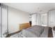 A calm bedroom features a dresser, soft rug, and lots of natural light at 4471 Dean Martin Dr # 2705, Las Vegas, NV 89103