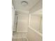 Hallway featuring tiled floors, neutral-toned walls, and recessed lighting, connecting different areas at 4480 Annie Oakley Dr, Las Vegas, NV 89121