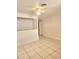 Bright, open living room with neutral walls, tiled floors, and a ceiling fan, ideal for relaxation at 4480 Annie Oakley Dr, Las Vegas, NV 89121