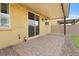 Covered patio with sliding glass doors extending the indoor-outdoor living space at 4519 Stardusk Falls Ave, North Las Vegas, NV 89084