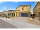 Inviting two-story home showcases a stylish exterior, well-maintained landscaping, and a spacious driveway at 4519 Stardusk Falls Ave, North Las Vegas, NV 89084