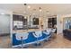 Modern kitchen with a large central island, stainless steel appliances, and stylish pendant lighting at 472 Cadence View Way, Henderson, NV 89011