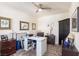 Functional home office featuring a large desk, stylish furnishings, and a neutral color palette with ample light at 472 Cadence View Way, Henderson, NV 89011